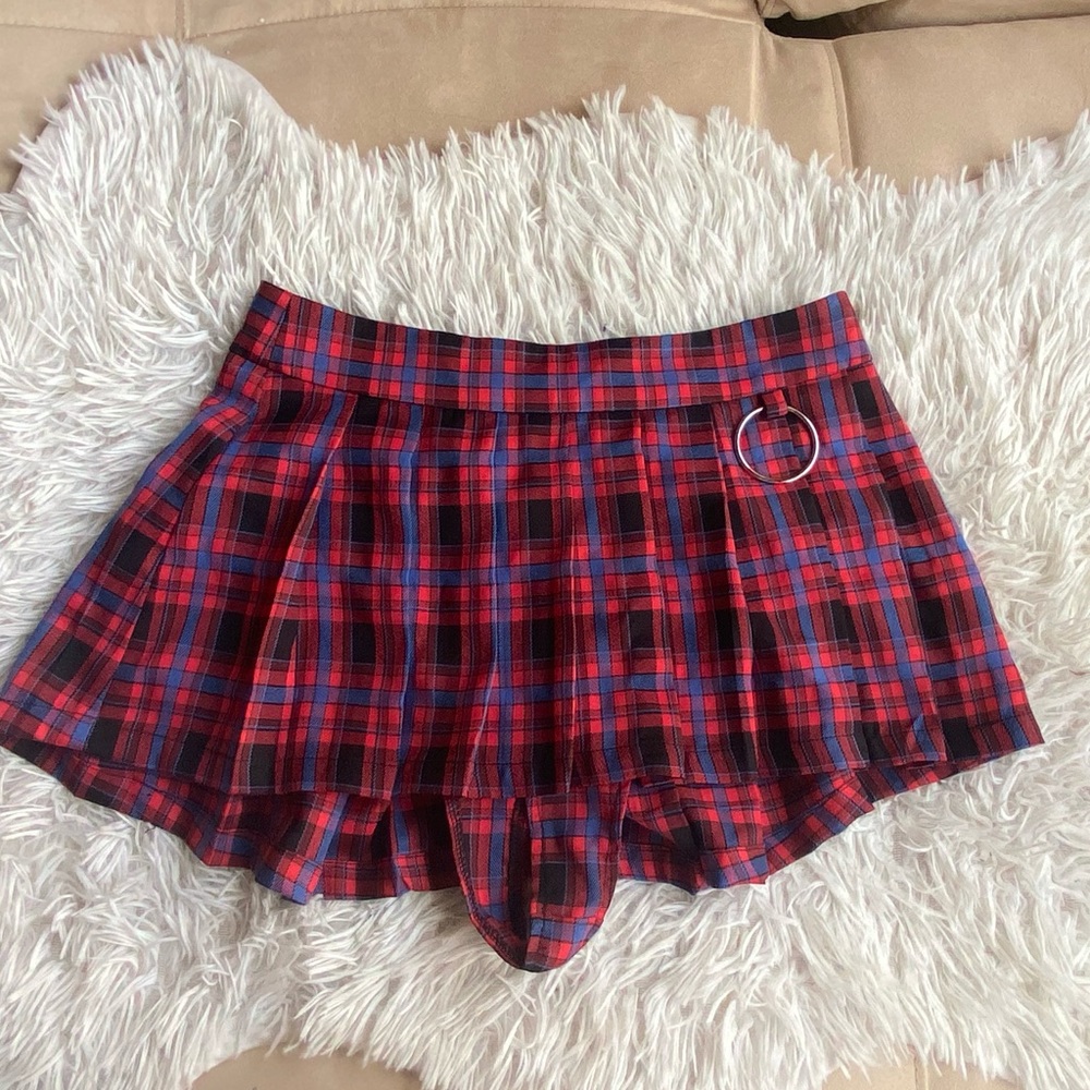 Mini, zip-up, plaid red skirt with metal circle accent